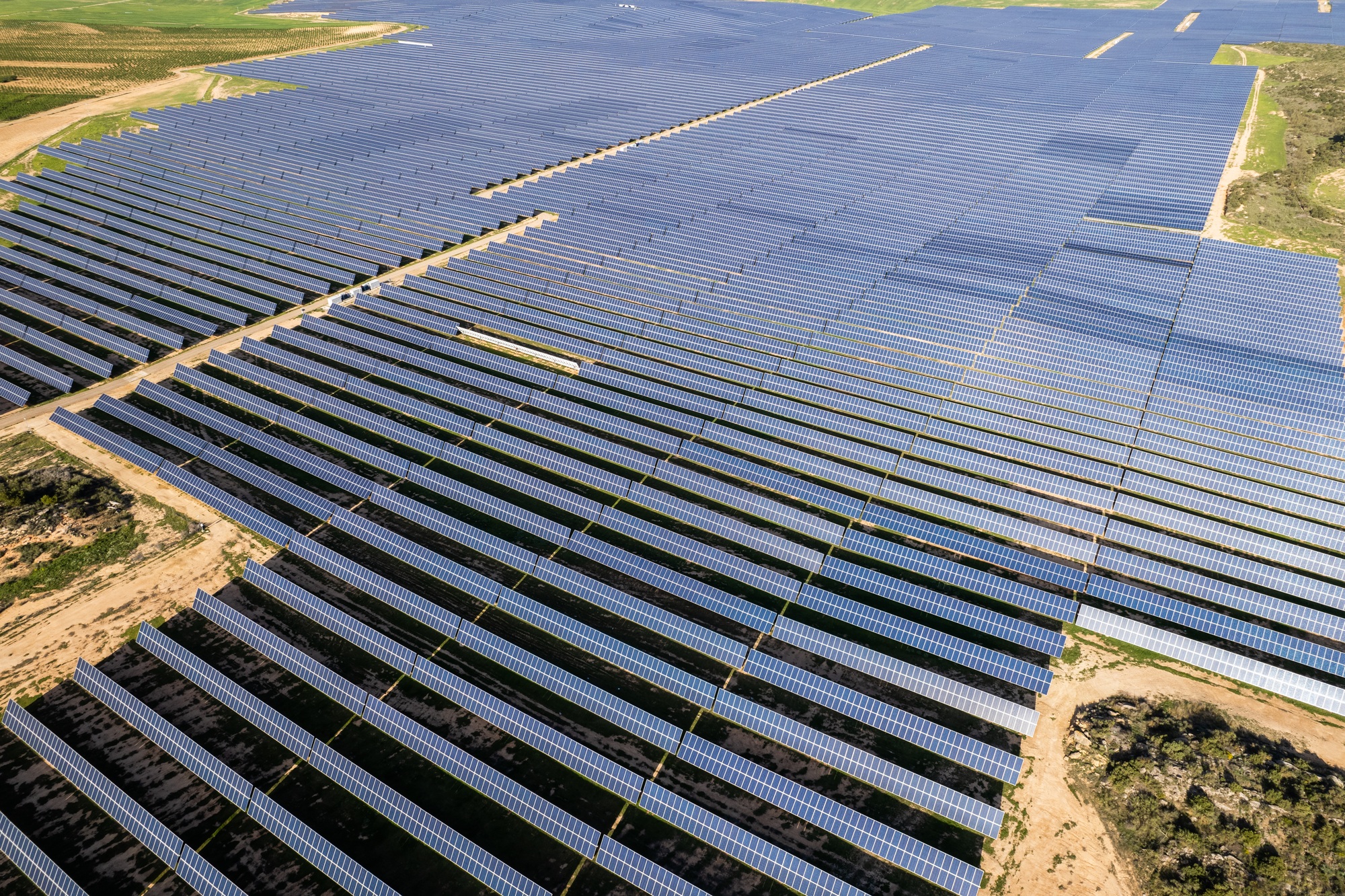 Clean electricity generation at a windfarm, part of our global customized energy solutions.